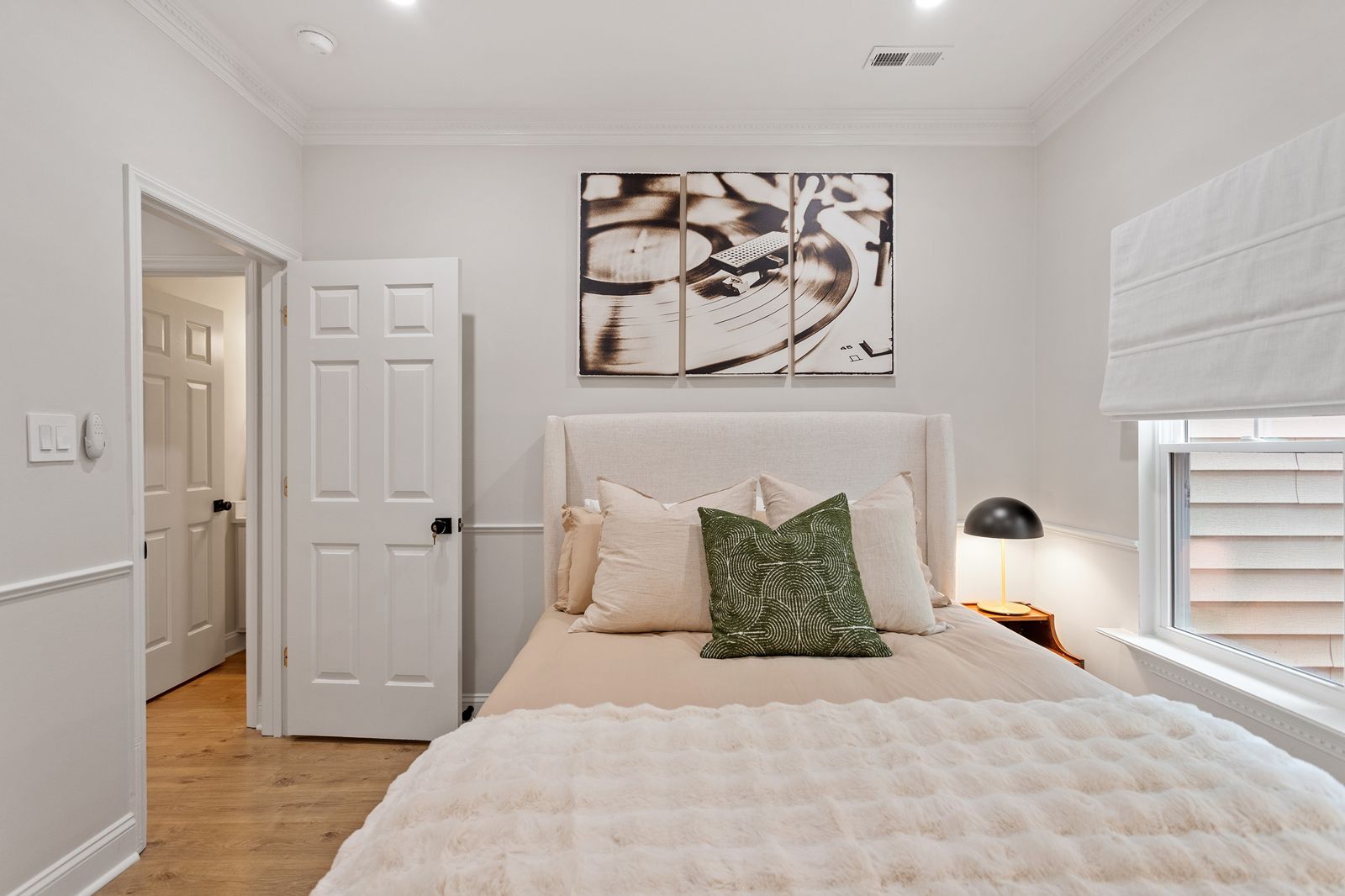 Second bedroom with a queen bed and a green dresser